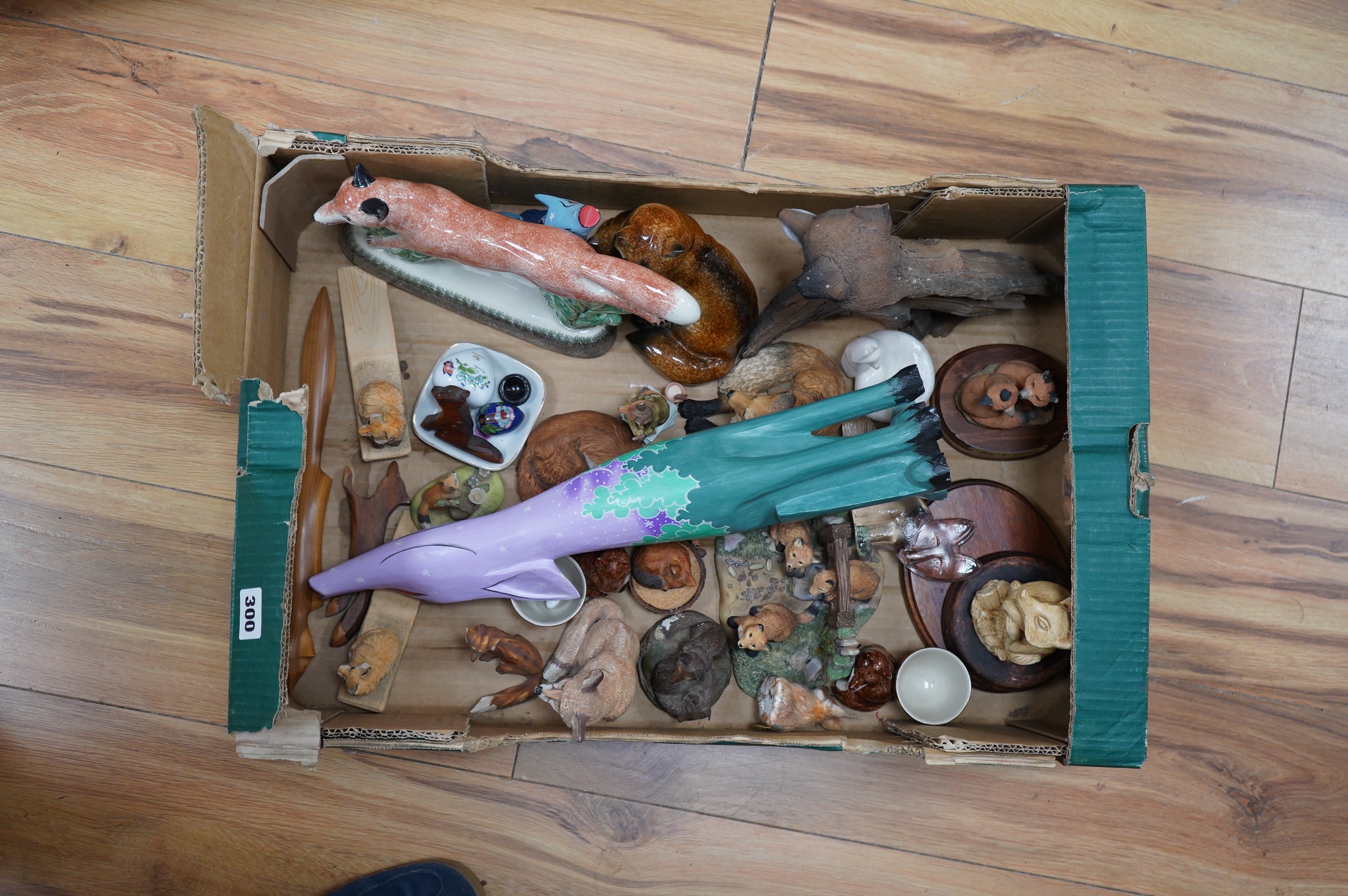 A quantity of ceramic, glass, resin and treen models of foxes, including a Rye pottery example, largest 45cm high. Condition - varies, mostly fair to good